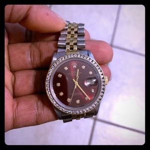 Silver red face Rolex wit diamonds
